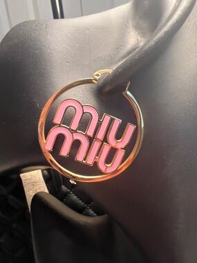 Gold-Tone Circular Charm with Pink Enamel Logo